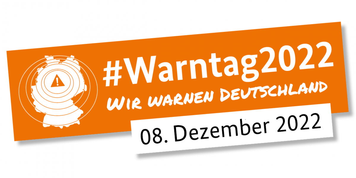 Banner Warntag 2020 Das Bild zeigt einen orangenen Banner mit der Aufschrift