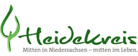 Logo des Heidekreises mit grünem stilisiertem Blatt und Schriftzug 'Heidekreis Mitten in Niedersachsen – mitten im Leben' in Grau und Grün.